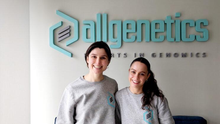 The image shows AllGenetics' staff Fátima Sánchez and Paula Ramilo.