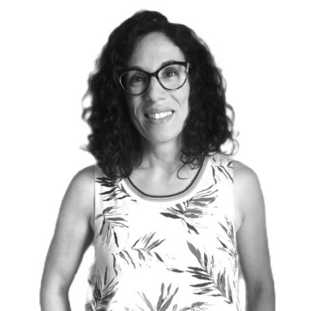 The image shows a black and white portrait of AllGenetics' staff Ania Pino-Querido.