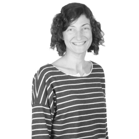 The image shows a black and white portrait of AllGenetics' staff Belén Carro.