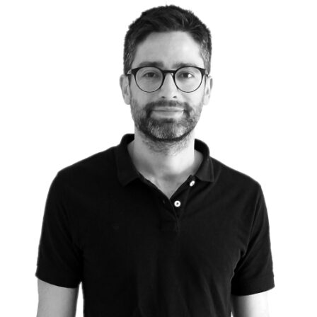 The image shows a black and white portrait of AllGenetics' staff Javier Garrido.
