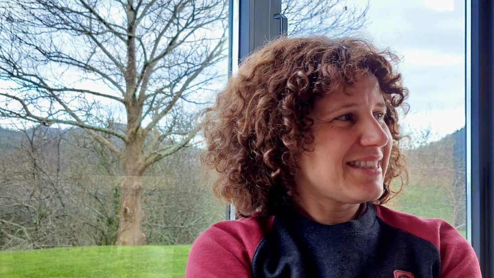 The image shows a portrait of AllGenetics' staff Dr Neus Marí-Mena.