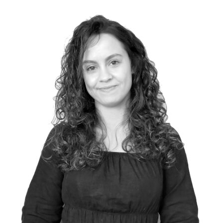 The image shows a black and white portrait of AllGenetics' staff Paula Ramilo.